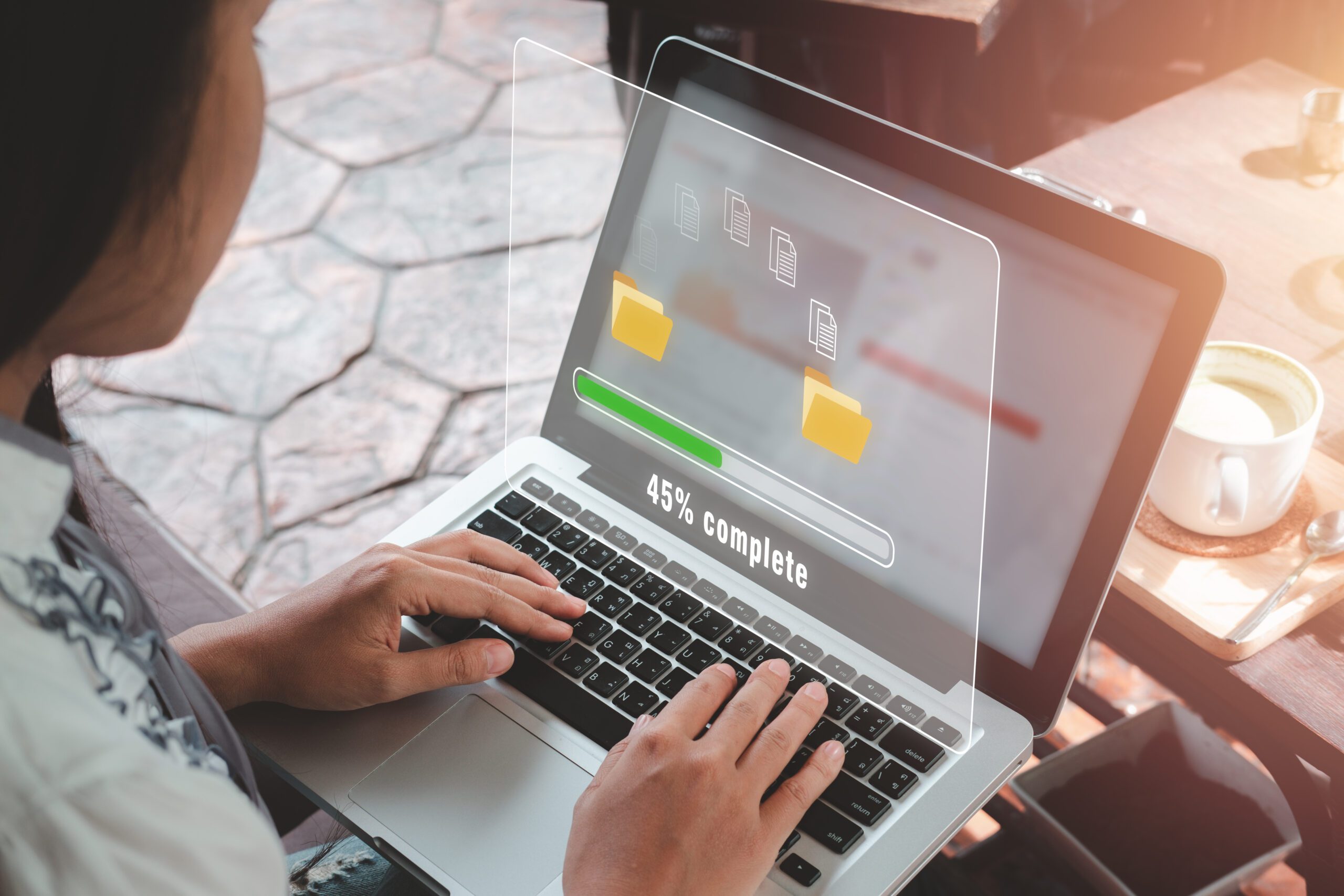 Transfer files data system relocation concept, Person hand using laptop computer waiting for transfer file process with loading bar icon on virtual screen....