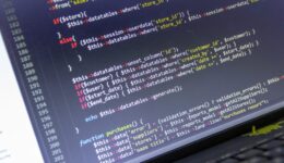 Modern web development background. Abstract pieces of PHP code of sale system.