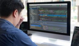 Programmers work on the development of coding and coding technology on white desks and website design, software, data processing companies, servers.