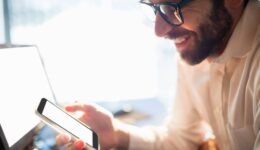 Businessman working and looking his phone