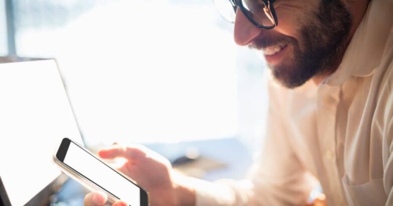 Businessman working and looking his phone Businessman working and looking his phone