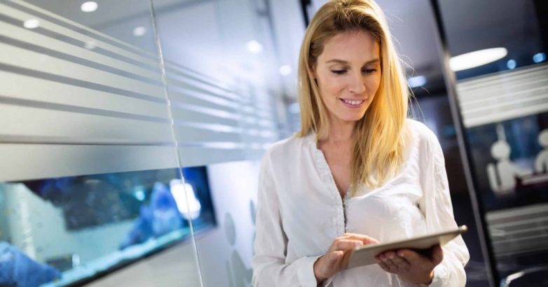 Businesswoman using tablet at information technology office