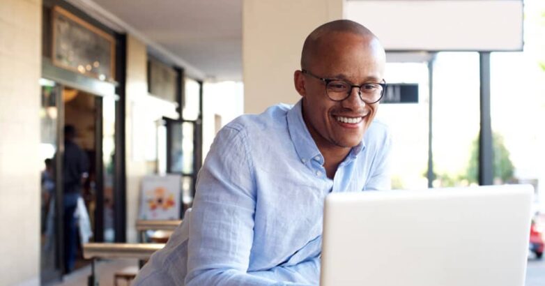 handsome african businessman working with laptop handsome african businessman working with laptop