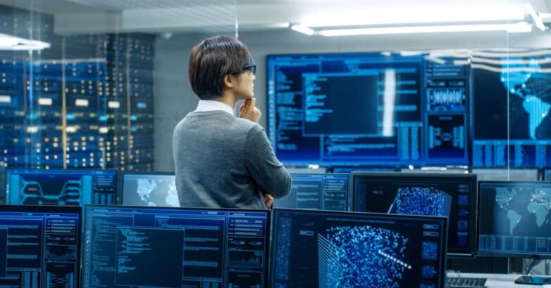 In the System Control Room Technical Operator Stands and Monitor In the System Control Room Technical Operator Stands and Monitor