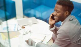African Businessman Calling by Phone