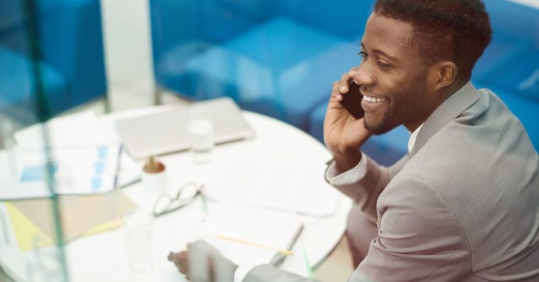 African Businessman Calling by Phone