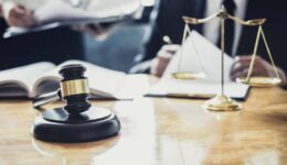 Male lawyer or Counselor working in courtroom have meeting with client are consultation with contract papers of real estate, Law and Legal services concept