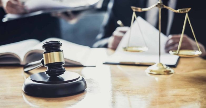 Male lawyer or Counselor working in courtroom have meeting with client are consultation with contract papers of real estate, Law and Legal services concept