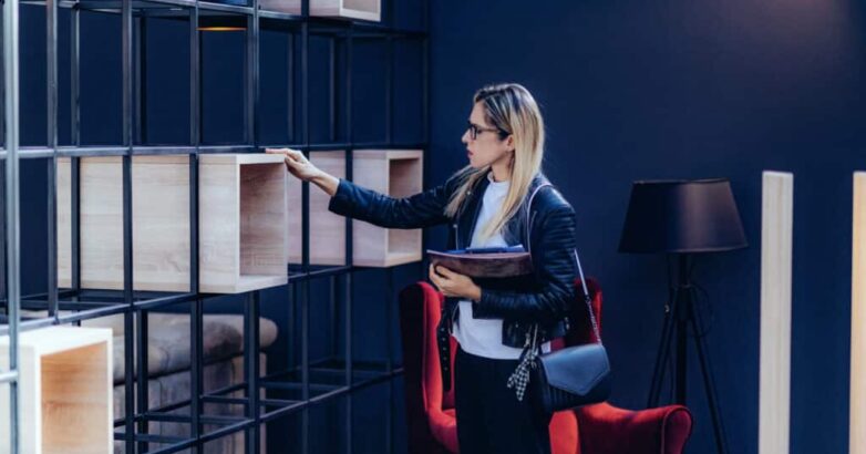 Interior designer checking design elements in home design showroom