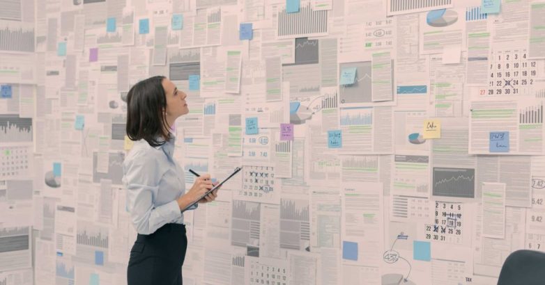 Corporate manager checking financial data and reports