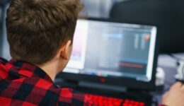 Developer of program code. Process of writing code in a special application.