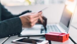 People online shopping gift for partner using credit card typing secure number to website.