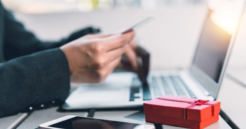 People online shopping gift for partner using credit card typing secure number to website.