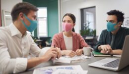 Business people in protective masks