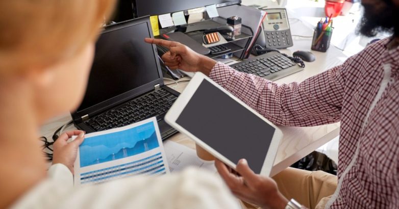 business team with laptop, chart and tablet pc
