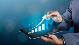 Graph of financial growth global communications Binary Smart Phones and world Internet Businesspeople press the phone to communicate in the Internet Stock chart Researching