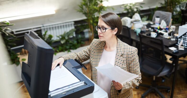 Businesswoman Scanning Documents