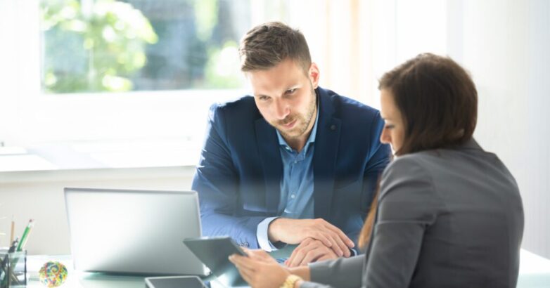 Two Businesspeople Using Digital Tablet