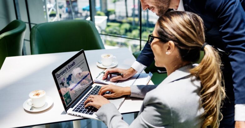 Business People Discussion Laptop Growth Success Concept Transforming an Insurer’s Data Management Strategy