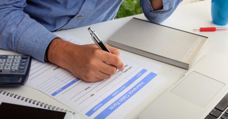 Man preparing an Insurance Claim Form