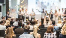 Young business team receiving award at best business project competition event.