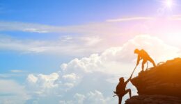 Climbing team are on the climb to the cliff,hiking and team work concept.