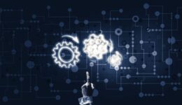 Glowing cogwheel mechanism icon on dark background as symbol of teamwork