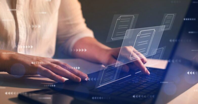 Businesswoman working on laptop with virtual screen. Process automation to efficiently manage files. Online documentation database and document management system concept.