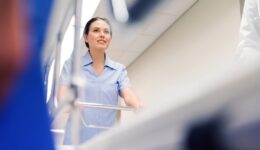 medic carrying hospital gurney at emergency