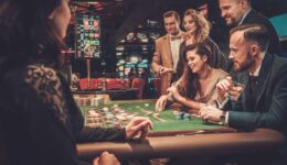 Upper class friends gambling in a casino