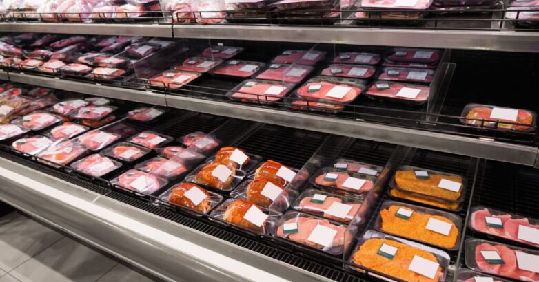 Shelves with fresh meat in supermarket