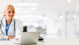 Doctor using laptop computer at the hospital.