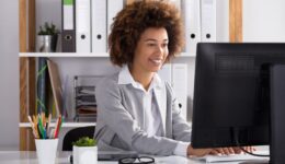 Happy Businesswoman In Office