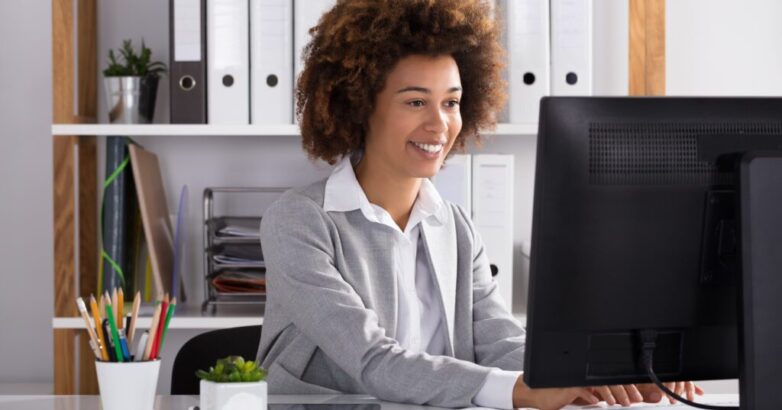 Happy Businesswoman In Office