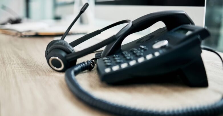 Telephone, contact us with call center, communication and headphone with microphone on work desk. Contact center, customer support and phone, consulting and customer service with callcenter voip. Telephone, contact us with call center, communication and headphone with microphone on work desk. Contact center, customer support and phone, consulting and customer service with callcenter voip.