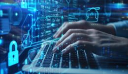 Hands Typing on Laptop with Futuristic Digital Interface and Cybersecurity Icons