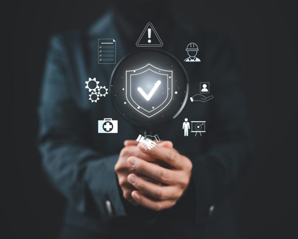 Work Safety and Compliance Concept. Businesswoman holding magnifying glass with icons work safety, compliance, risk management, and operational efficiency, emphasizing importance of safety standards.