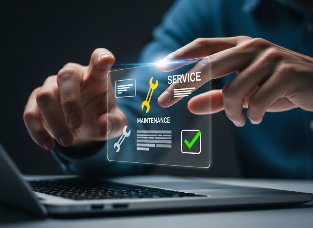Businessman using a futuristic virtual interface on a laptop for online customer service and technical maintenance management