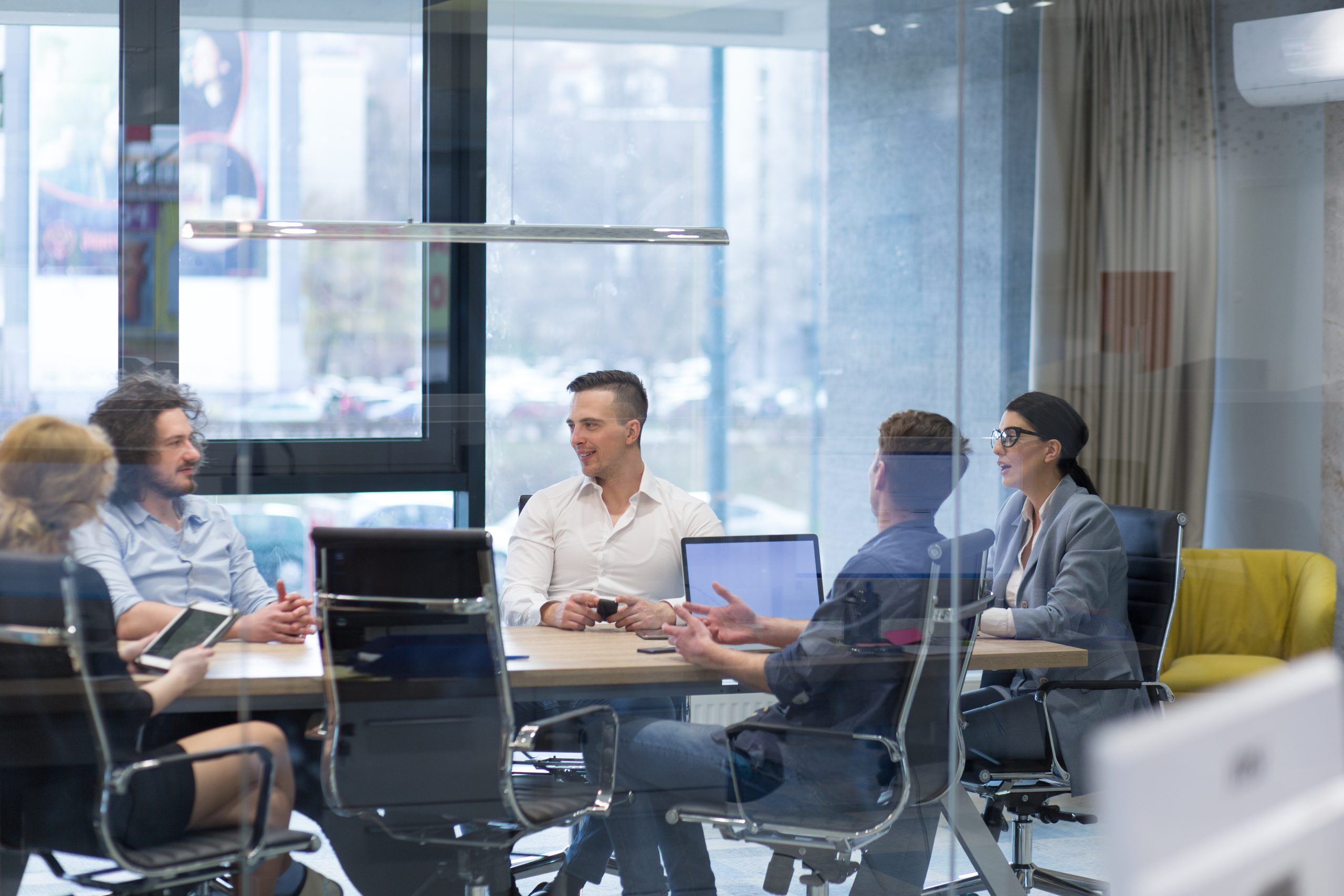 Startup Business Team At A Meeting at modern office building